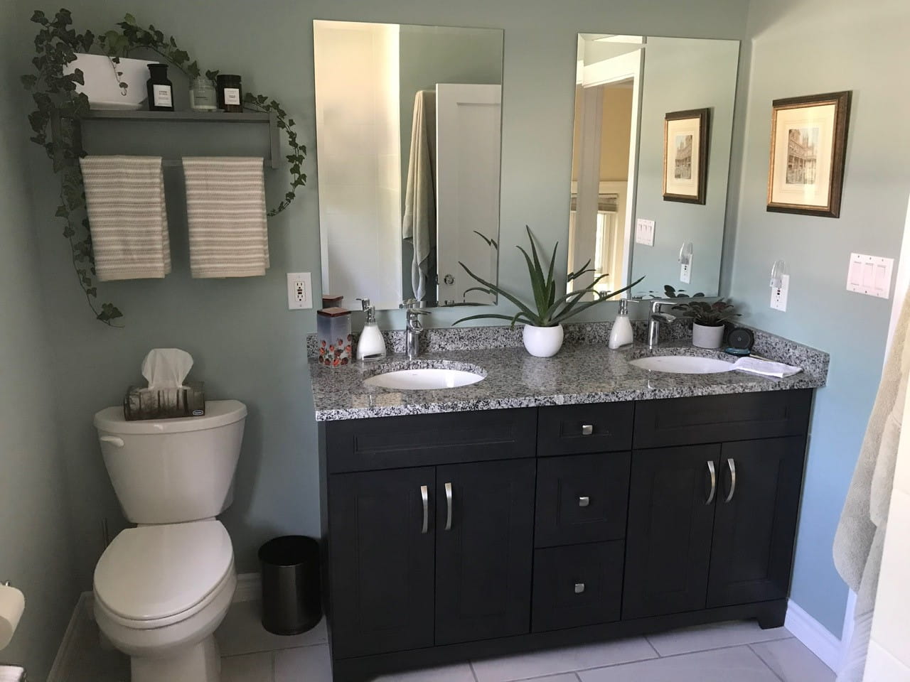 Shower bench with mosaic tile floor and marble-look walls