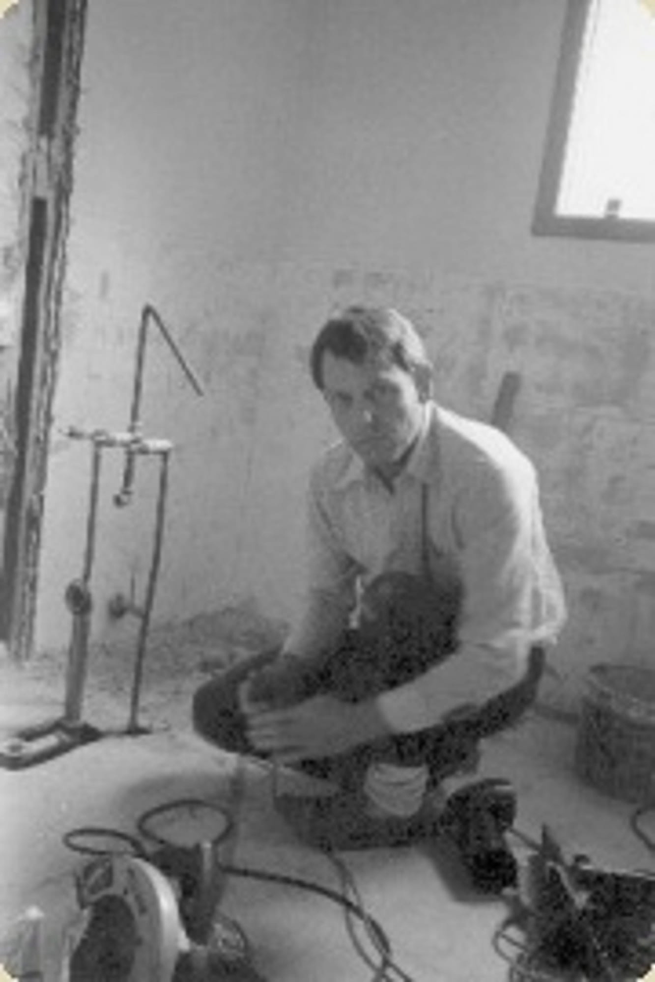 Karl W. Schmidt setting tile on a bathroom job early in his career