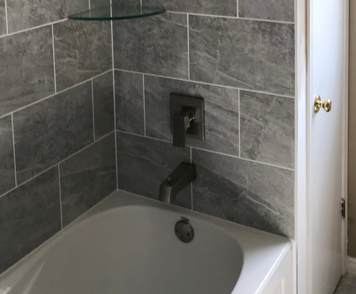 New bathroom faucet installed on a vanity sink