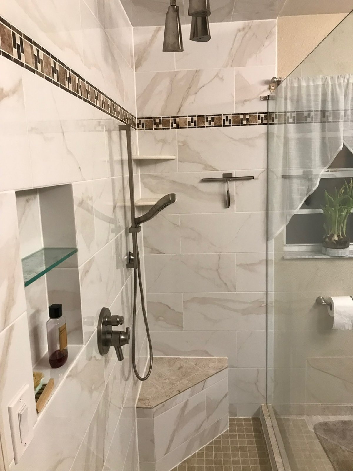 Recessed tiled shower shelf niche